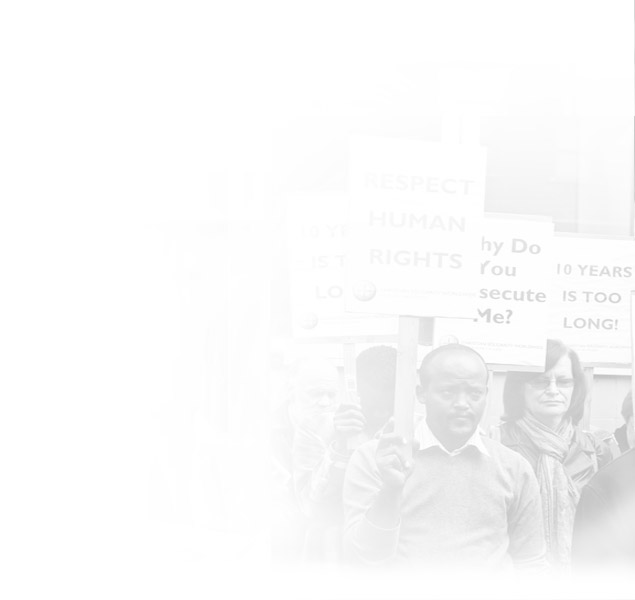 Photo of people carrying protest signs for human rights