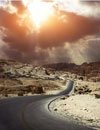 Image of winding road and sunset