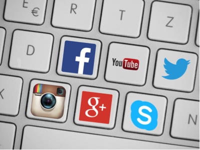 Graphic of keyboard with social media icons on buttons (facebook, youtube, twitter, instagram, google, and skype)