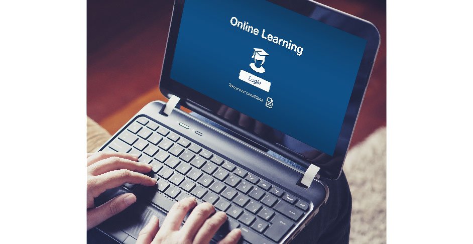 Laptop with fingers touching keyboard