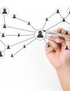 Hand drawing a diagram of a person in a circle connected to other circles of people