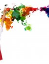 Girl painting a colorful world map on the wall