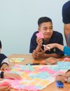 Students brainstorming with sticky notes