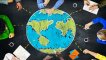 Drawing of the Earth appears to sit on a black desk with several hands around the desk holding pencils