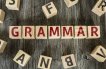 Letter blocks spelling out the word "Grammar" in red letters
