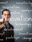 Man appears to write text on camera reads "Innovation" surrounded by other words